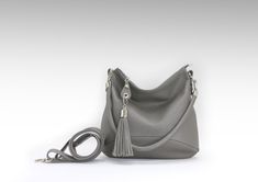 "I made this hobo bag of soft Italian pebbled leather of excellent quality in dark gray. If you want to change the color, just select it in the menu when buying. crossbody bag This soft comfortable bag is also quite roomy. You can put in it all the things that every woman needs throughout the day. The soft form and two detachable handles (a short round handle and a long crossbody belt ) make this bag comfortable for daily use. This purse has an outer zippered pocket. The zipper on top will keep Gray Leather Hobo Bag For Everyday Use, Gray Leather Hobo Shoulder Bag, Gray Leather Hobo Bag For Daily Use, Gray Crossbody Bag With Leather Handles, Gray Crossbody Bag With Zipper Closure, Everyday Crossbody Hobo Bag With Silver-tone Hardware, Cheap Leather Hobo Bag With Silver-tone Hardware, Yellow Leather Bag, Luxury Crossbody Hobo Bag With Silver-tone Hardware