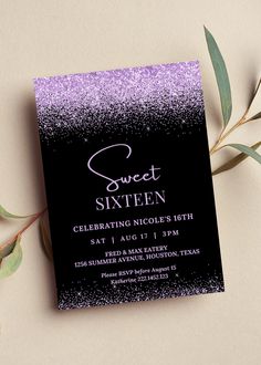 a black and purple birthday party card with silver glitter on the front, next to an olive branch