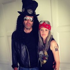 a man and woman dressed up in costumes