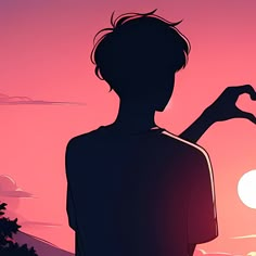 a person standing in front of a sunset with their hand up to the sun,