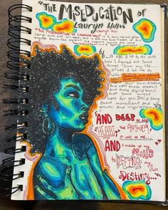 a spiral notebook with an image of a woman's face and words on it