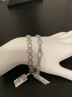 Gorgeous modern art deco open hexagon shape link fancy tennis bracelet. Estimated 2.00 carats of round brilliant diamonds pave set in 14 karat white gold with a hidden box clasp. Excellent Condition Stamped Y2.14/57 and 14k 12 Natural earth mined diamonds in each of the 25 links untreated, near colorless si2 clarity Total of 300 diamondsNote: For international shipping please make sure that the item is legally able to be imported to your country. Some countries do not allow the importing of fine Elegant Octagon Diamond Bracelet For Formal Occasions, Elegant Octagon Diamond Bracelet, Silver Round Diamond Bracelet With Baguette Diamonds, Formal Octagon Diamond Bracelet, Elegant White Hexagon Jewelry, Silver Diamond Hexagon Jewelry, Hexagon White Gold Jewelry With Diamond Accents, Silver Hexagon Jewelry With Diamond Accents, Link Modern