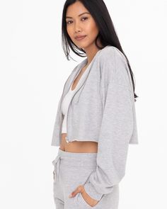 Cozy comfort, cropped perfection. This cropped zip-up hoodie is the essential loungewear piece your routine needs. Fit: Relaxed, cozy fit for an effortlessly lived in feel. Features: Simple design for laid-back vibes. Raw bottom edge, metal zipper closure, and perfectly cropped length. Why You’ll <3 It: This cropped is a versatile staple that transitions seamlessly from coffee runs to morning workouts. Your new happiness uniform: Complete the matching set with our Feel Good French Terry Sweatpan Cropped Zip Up Hoodie, Cropped Zip Up, Trendy Swimwear, Sweater Tank Top, Cropped Jacket, Lounge Set, Metal Zipper, Crop Jacket, Grey Hoodie