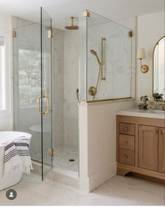 a bath room with a sink a mirror and a tub