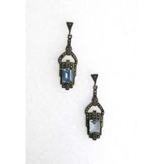 A beautiful pair of blue aquamarine gemstone and sterling silver drop earrings in the Art Deco style, circa late-20th century. Earrings are for pierced ears. Very Good condition as shown in images. No issues. Marked '925' for sterling silver on back of both as shown in last image. A beautiful pair to dress up or down. Dimensions: 1.88" Long Vintage Sterling Silver Earrings With 17 Jewels, Art Deco Blue Drop Earrings, Blue Art Deco Drop Earrings, Art Deco Silver Gemstone Earrings, Silver Art Deco Gemstone Earrings, Silver Gemstone Art Deco Earrings, Ornate Blue Earrings For Formal Events, Ornate Blue Earrings For Formal Occasions, Victorian Blue Earrings For Formal Occasions