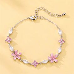 Pink Crystal Cherry Blossom Bracelet Indulge in a touch of loveliness with our Pink Crystal Cherry Blossom Bracelet. Handcrafted with delicate pink crystals, this bracelet is perfect for adding a touch of elegance to any outfit. Embrace your feminine side with this charming accessory. Pink Accessories Aesthetic, Cherry Blossom Bracelet, Simplistic Jewelry, Pink Chain, Blossom Bracelet, Minimalist Jewellery, Pretty Jewelry Necklaces, Neck Jewelry, Neck Jewellery