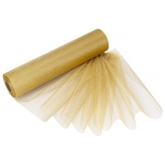 a roll of gold colored tissue paper on top of a white tablecloth rolled up