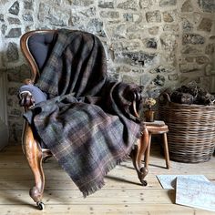 a chair with a plaid blanket on top of it