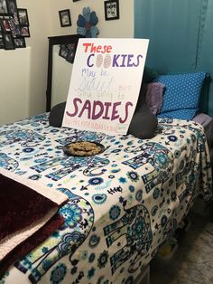 a bed with a sign on it that says these cookies may be baked but saddes