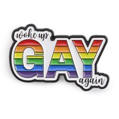 a pin with the words,'we woke up gay again'in rainbow colors