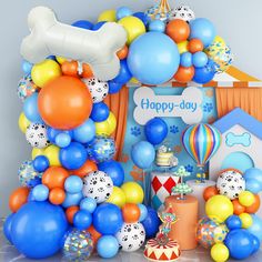 an assortment of balloons and decorations for a dog themed birthday party