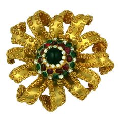 Attractive gilt bronze flower brooch by Maison Gripoix for CoCo Chanel. Handmade streamers are edged with looped wire to free form the many "petals" of the flower. A dome set with poured glass ruby and emerald pate de verre cabochons and tiny pastes completes the look. Excellent Condition L2.5". W2.5" UNSIGNED. Chanel Flower, French Baroque, Poppy Brooches, Chanel Brooch, Chanel Couture, Antique Brooches, Couture Vintage, Chanel Jewelry, Red Poppies