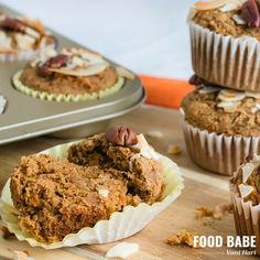 several muffins sitting on top of a wooden cutting board