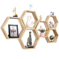 the shelves are made out of wooden hexagons and have various figurines on them