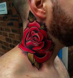 a man with a rose tattoo on his neck