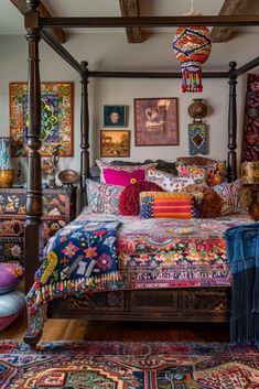 a bed with lots of colorful pillows on top of it