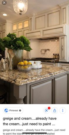 an image of a kitchen with white cabinets and granite counter tops that has lemons on it