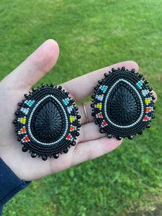 Silver and fire color beaded earrings. Back with black glitter fabric and a nickel free fingernail post. Centers are resin. Beautiful Beaded Earring, Fire Color, Ribbon Skirt, Stitch Earrings, Beaded Earring, Earrings Beaded, Glitter Fabric, Earring Ideas, Jewelry Making Tutorials