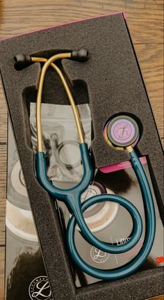 a stethoscope and cd in a box on a table