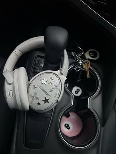 the inside of a car with headphones and keys