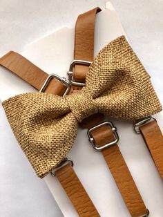 "Vintage Tan PU leather suspenders 1/2\" wide and bow tie set. Size 6m-2yo years old suspenders are 29\"long. Bow tie measures 3 1/2x2\", neck strap is 14 1/2\" long. Size 3-6 years old suspenders are 33\" long. Bow tie measures 4x2 1/4\", neck strap is 15 1/2\" long. Size 7-11 years old suspenders are 37\" long. Bow tie measures 4 1/2x2 1/2\", neck strap is 16 1/2\" long. Size adult suspenders are 55\" long. Bow tie measures 5x 2 3/4\", neck strap is 24\" long. Please allow me 2-3 days to make Long Bow, Seersucker Suit, Leather Suspenders, Burlap Bow, Wedding Order, Bow Tie Set, Burlap Bows, Burlap Fabric, Easter Outfit