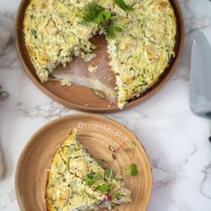 two plates with slices of quiche on them