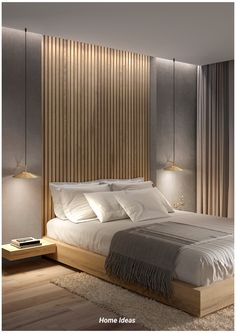 a large bed sitting next to two lamps on either side of the headboard and foot board