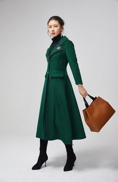 "This stunning dark green wool coat for womens is beautifully fitted and tailored for a classic, feminine design. There is a brooch decoration on lapels.The long wool coat features dark green, a slim fitting bodice with long sleeves and fitted waist leading into a long,flowing skirt coat. Details : * dark green wool blend fabric with polyester lining * two pockets * button closure in front * lapel collar * long sleeves * brooch decoration * winter coat, spring coat, womens coat * mid calf length Elegant Green Wool Coat, Elegant Green Wool Outerwear, Elegant Green Wool Coat For Fall, Elegant Green Long Wool Coat, Elegant Green Wool Coat For Winter, Elegant Green Outerwear With Lapel Collar, Elegant Green Outerwear For Office, Elegant Green Office Outerwear, Green Long Coat For Formal Occasions