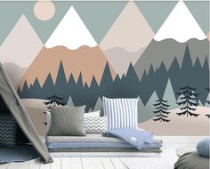 a room with mountains and trees painted on the wall