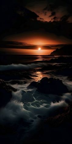 the sun is setting over the ocean with waves crashing in front of it and dark clouds