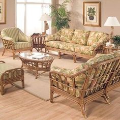 the living room is decorated in wicker and tropical colors with palm leaves on it