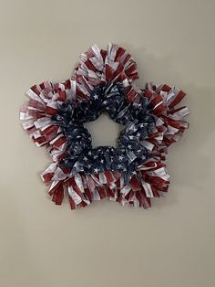 an american flag wreath hanging on the wall