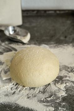 a ball of bread sitting on top of flour