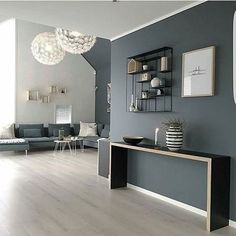 a living room with grey walls and white flooring