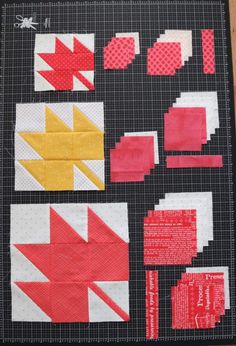 a quilted table top with different types of fabric on it and some type of scissors