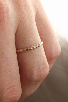 There is no better piece than a simple gold band when deciding on your first solid gold investment piece. A dainty textured band is something that can stack with other pieces, you can wear it alone for a more minimal look, and the best thing is it's not going to break the bank. I love a ring with a little texture because it plays with light a little more than a smooth polished band and has a hint of sparkle without adding any diamonds or other stones. Our Dainty solid gold textured band Simple Rings, Ring Making, Gold Bride Jewelry, How To Make Rings, Ring Ideas