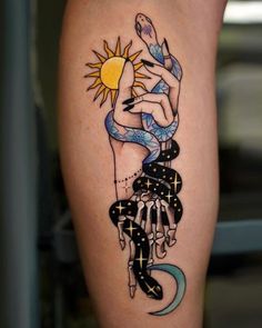 a woman's leg with a tattoo on it and the sun above her arm