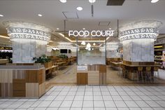 the inside of a food court with tables and chairs