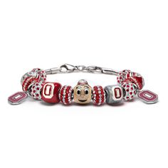 This bracelet features seven officially licensed OSU Buckeyes charms and is accented by eight crystals in clear and iconic Ohio State scarlet. A chic and eye-catching way to cheer on your Ohio State Buckeyes team! This is the perfect gift for any attending Ohio State University student, Buckeyes college football fan or loyal Ohio alumni. OSU charms and bracelets are made of stainless steel. Go Bucks! FEATURES DETAILS * Product Dimensions: 0.0 x 0.0 x 0.0 inches * Item Weight: 0.5 pounds * Shippi Buckeye Jewelry, Ohio State Gifts, Brutus Buckeye, Osu Buckeyes, Ohio State University, Necklace Box, Ohio State Buckeyes, University Student, Photo Bracelet