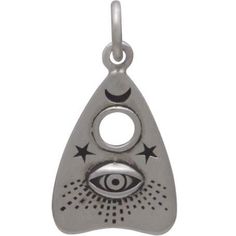 Those fascinated with the occult will be delighted by this sterling silver Ouija planchette charm with all-seeing eye. It features details you might find on the real thing, like tiny stars & moon, the hole for selecting letters, and an all-seeing eye. The Ouija board launched in the 1800s at a time when Americans were obsessed with communicating with loved ones who had passed. Seances were common then, complete with rapping walls and turning tables. Enter the Ouija board. This simple device made Silver Symbolic Good Luck Charms, Silver Good Luck Symbolic Charms, Nickel-free Sterling Silver Spiritual Charms, Symbolic Eye-shaped Silver Jewelry, Ouroboros Snake, Palm Tree Necklace, Ouija Planchette, The Occult, Travel Charms