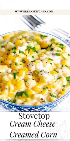 a blue and white bowl filled with cream cheese cremed corn next to a fork