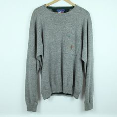 "Vintage 90s Tommy Hilfiger grey wool/cotton blend sweater size M. It is gently used, no holes/stains or tears. Please check the measurements for size/fit as it seems quite oversized. Shoulders 26\" Sleeve 27\" Chest 56\" Length 27\" 108" Tommy Hilfiger Long Sleeve Gray, 90s Tommy Hilfiger, Mens Pullover, Vintage Tommy Hilfiger, Pullover Men, Crewneck Sweater, Houston Tx, Sweater Outfits, Pullover Sweaters