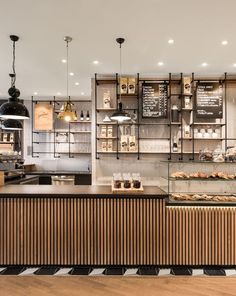 a bakery with lots of counter space and food items on display in the front window