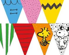 a group of different colored kites with black and white pictures on them, each one has a cartoon dog in the middle