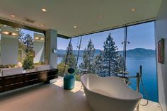 a large bath tub sitting in the middle of a bathroom