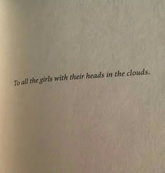 an open book with the words to all the girls with their heads in the clouds