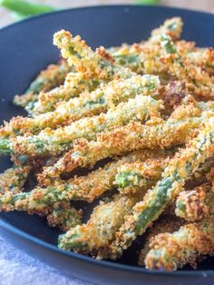 fried green beans in a blue bowl on a table