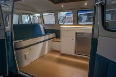 the interior of a bus with wood flooring