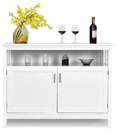 a white cabinet with two wine glasses and a vase filled with yellow flowers on top