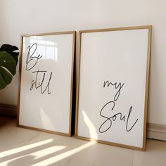 two framed art prints with the words be still and my soul written in black ink